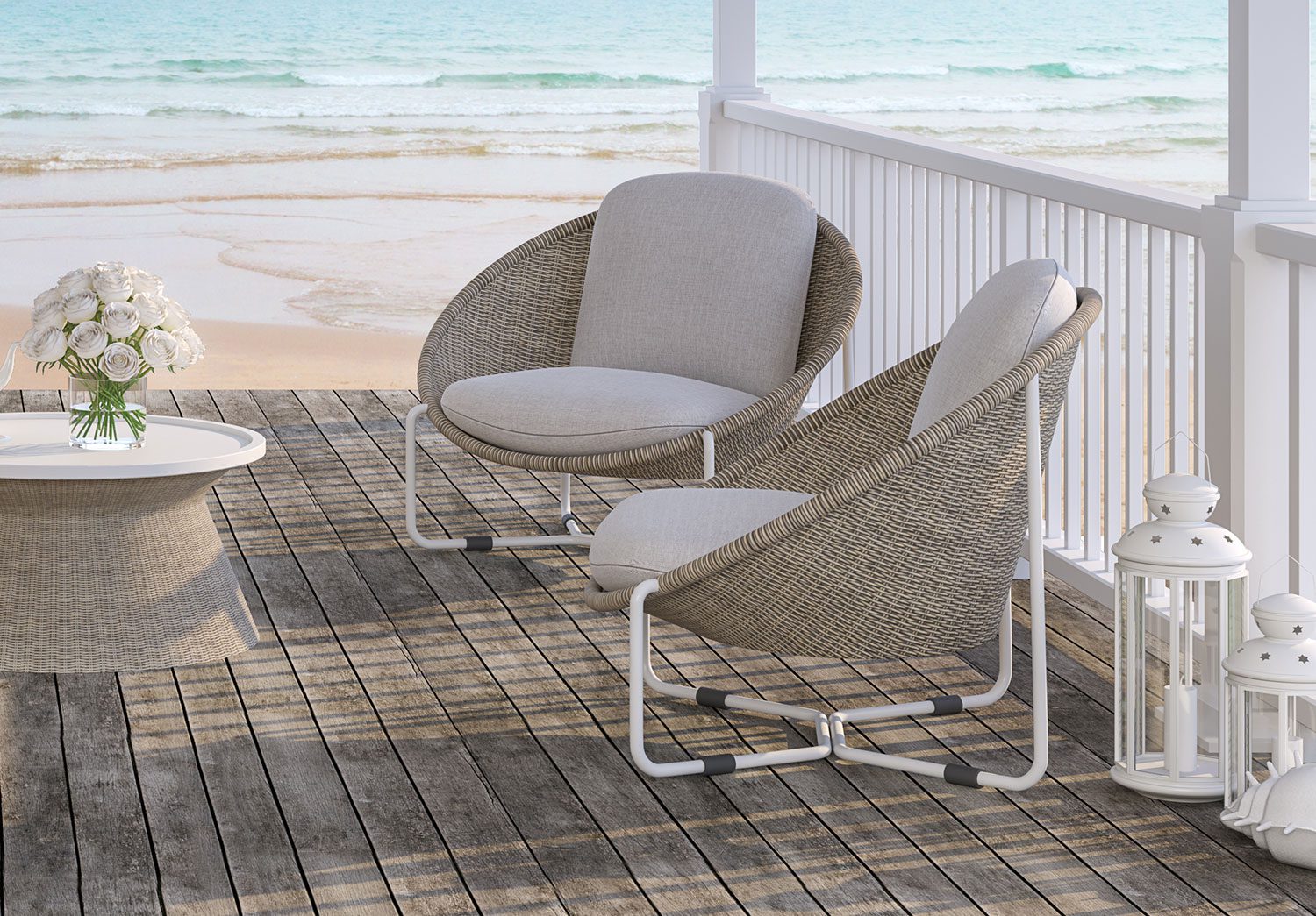wicker chairs on porch overlooking beach
